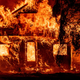 A home burns as flames from the Dixie fire tear through the Indian Falls neighborhood of unincorporated Plumas County, California on July 24, 2021. - The Dixie fire, which started only a few miles from the origin of the deadly Camp fire, has churned through more than 185,000 acres and continues to burn towards rural communities.